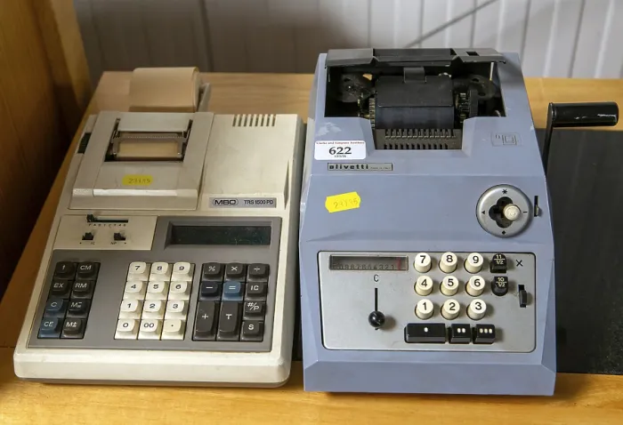 Framed Print : Vintage technology adding machines on sale at auction