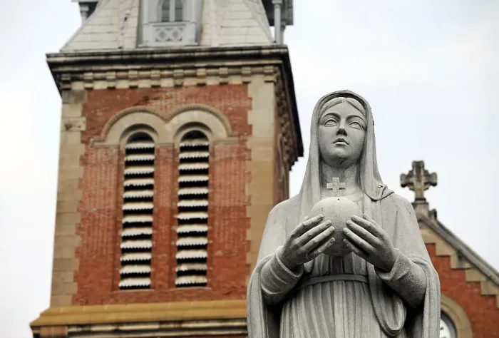 Framed Print : Virgin Mary statue on the square of the Paris Commune in front of the neo-Romanesque Notre Dame Cathedral