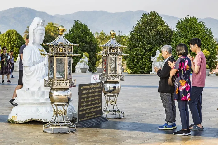 Framed Print : Visitors praying at the Guan Yin (Goddess of Mercy)