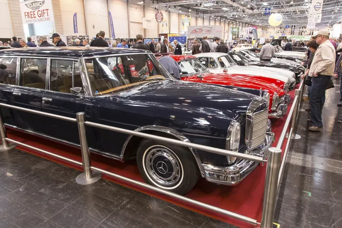 Framed Print : Visitors to Techno Classica take a look at a Mercedes Benz 600