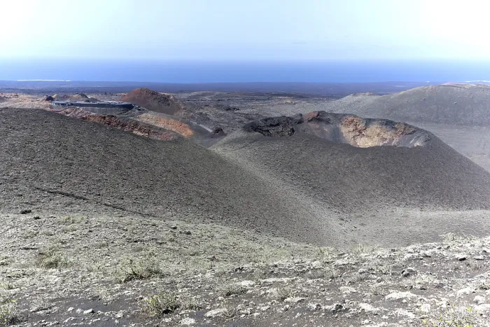 Framed Print : Volcanic landscape with visitor centre in Timanfaya National Park