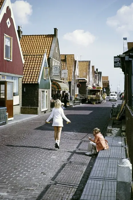 Framed Print : Volendam, Netherlands, 1973: two children playing in the street, one of them jumping