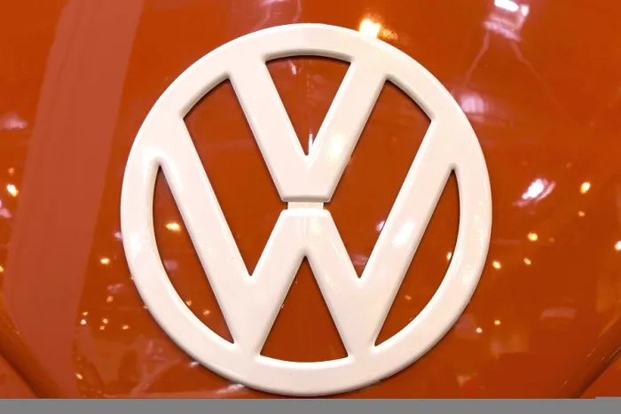 Framed Print : The front of a Volkswagen bus with a large VW logo