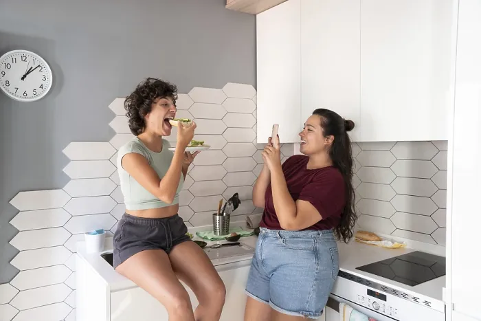 Framed Print : A warm scene of a lesbian couple in a kitchen
