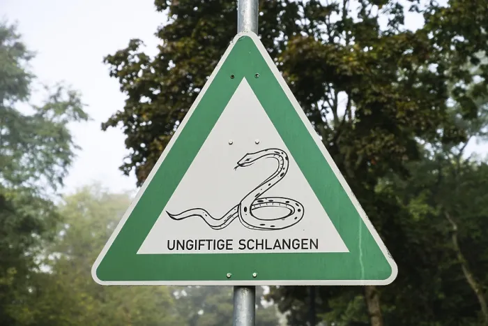 Framed Print : Warning sign, non-poisonous snakes Framed Print : Warning sign, non-poisonous snakes