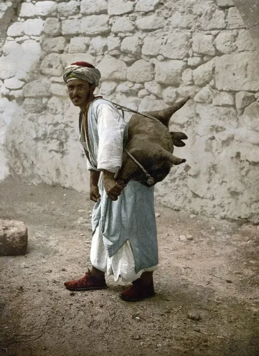Framed Print : Water carrier, water seller with a goat bellows in Jerusalem