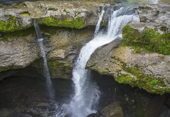 Framed Print : Water falling into a river over moss-covered rocks Framed Print : Water falling into a river over moss-covered rocks