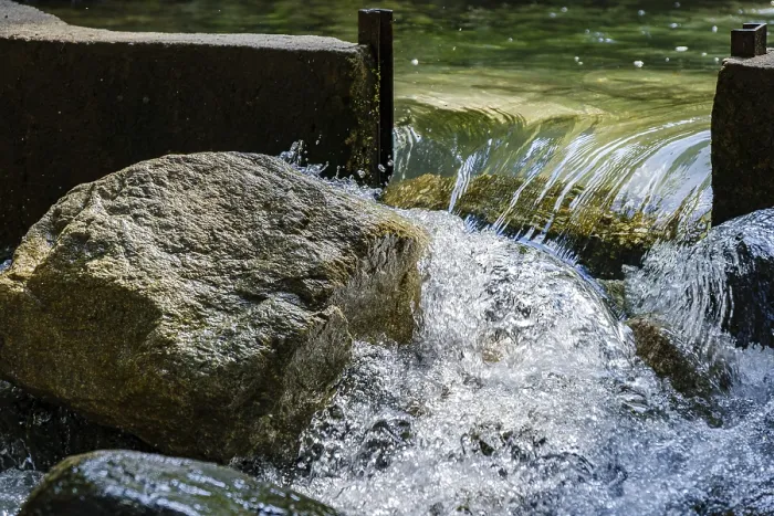 Framed Print : Water flows through an open dam