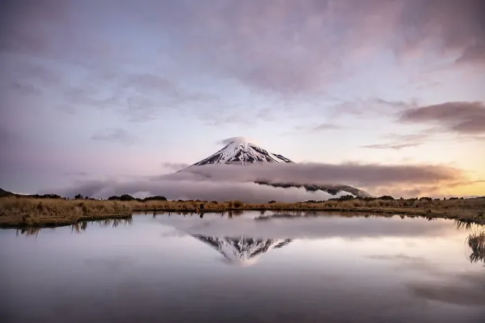 Framed Print : Water reflection in Pouakai Tarn Mountain Lake at sunset