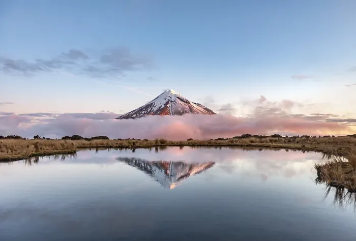 Framed Print : Water reflection in Pouakai Tarn Mountain Lake at sunset