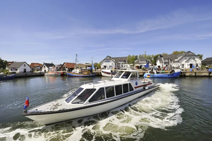 Framed Print : Water taxi 'MY Pirat' in a turning maneuvre in the harbour of Vitte