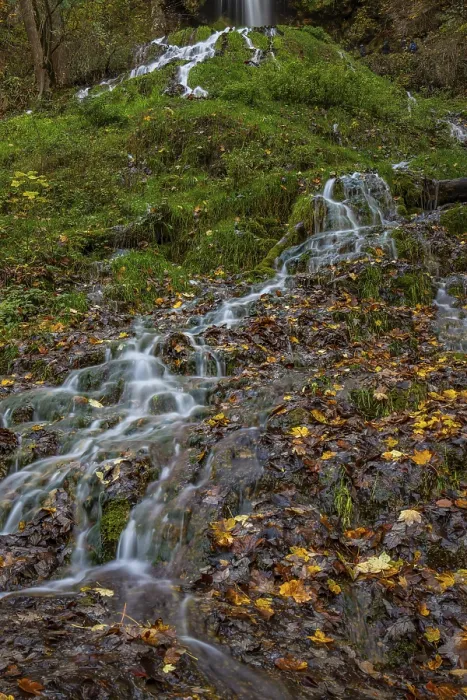 Framed Print : Waterfall in autumn in the middle of the forest