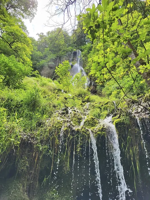 Framed Print : The waterfall in Bad Urach, embedded in a lush green forest landscape