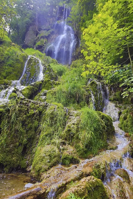 Framed Print : The waterfall in Bad Urach, embedded in a lush green forest landscape