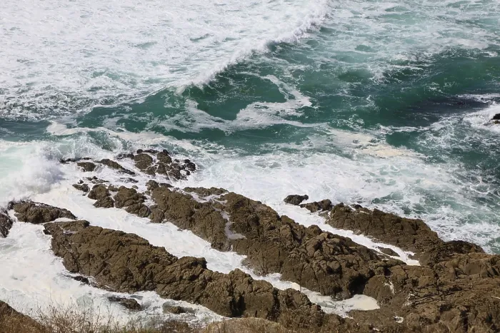 Framed Print : Waves break on the rocky coast off the bay of Greve de Dalbosc