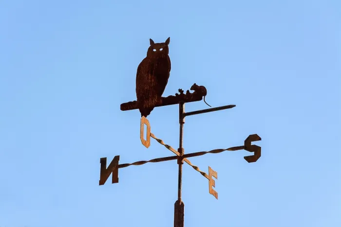 Framed Print : A weathercock displays an owl silhouette