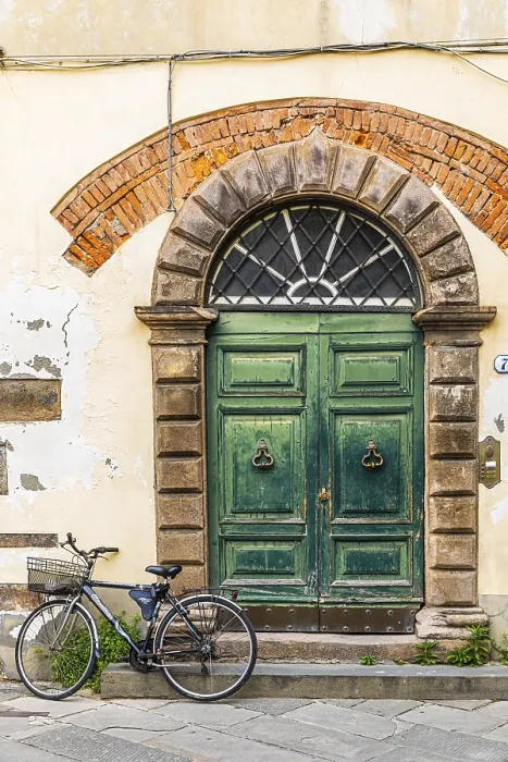 Framed Print : Weathered old arched entrance door
