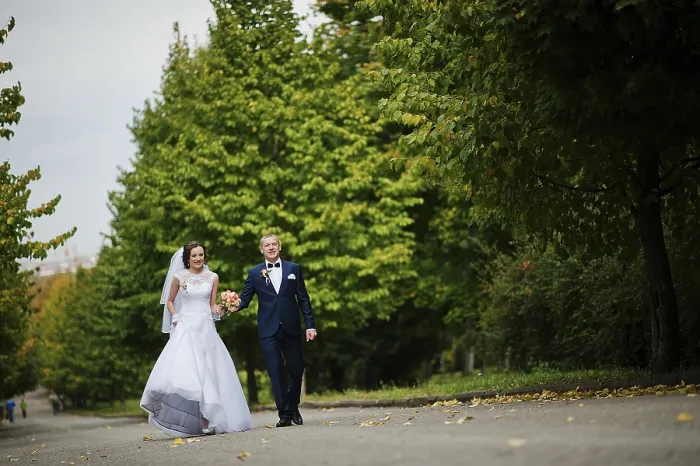 Framed Print : Wedding couple walking at green park