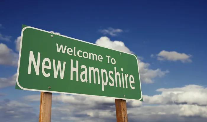 Framed Print : Welcome to new hampshire green road sign over blue sky with some clouds Framed Print : Welcome to new hampshire green road sign over blue sky with some clouds