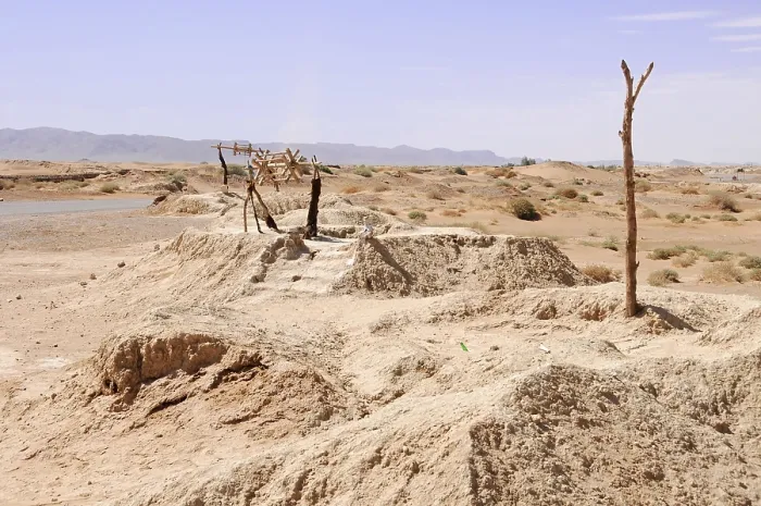 Framed Print : Well, wooden scaffolding on a sandy hill in a dry desert landscape Framed Print : Well, wooden scaffolding on a sandy hill in a dry desert landscape