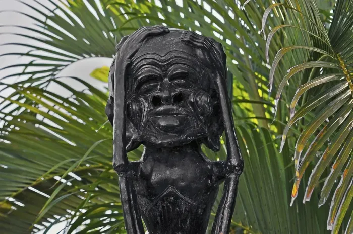 Framed Print : Whimsical figure with a large head near Amed, Bali, Indonesia, Asia