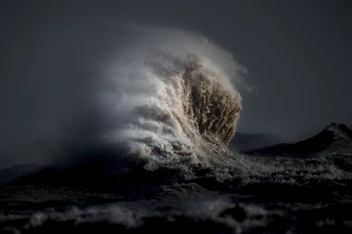 Framed Print : Whipped by strong winds from a seasonal weather patterns