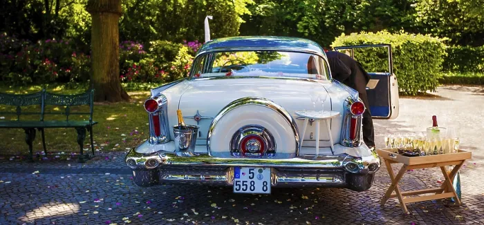 Framed Print : White Cadillac with champaign glasses
