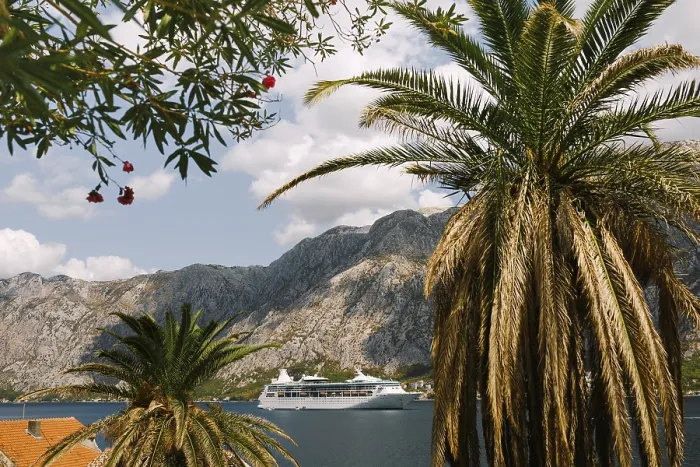 Framed Print : White cruise liner against the backdrop of rocky mountains