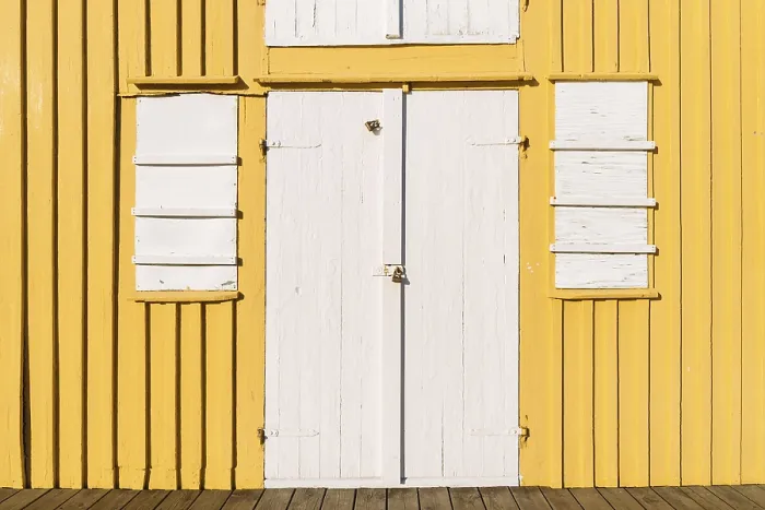 Framed Print : White door and window, front side yellow boathouse