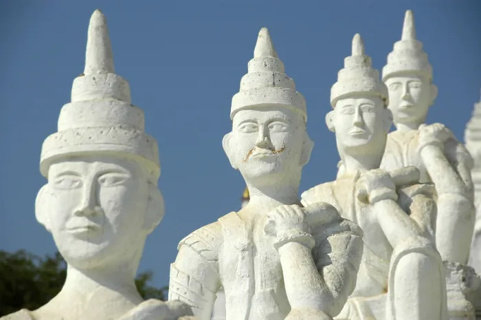 Framed Print : White figurines in a row, one below and in front of the other at a Buddhist temple