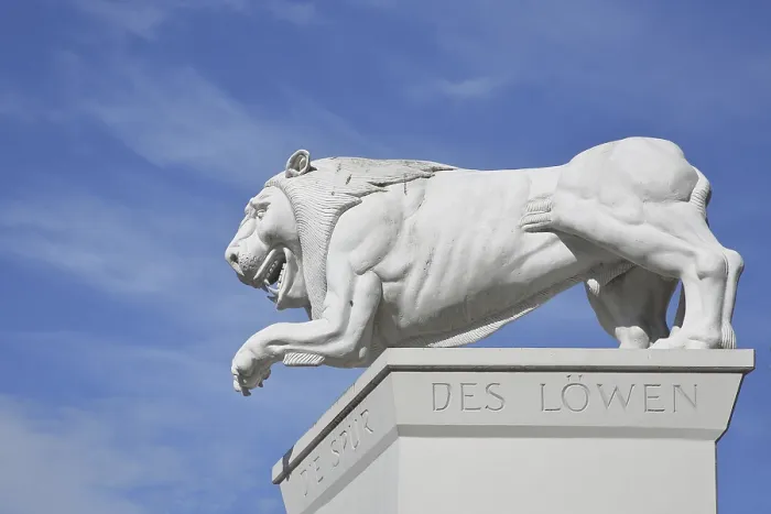 Framed Print : White Lion Monument by Peter Lenk 1996 with inscription Die Spur des Lowen