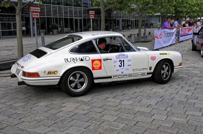 Framed Print : White Porsche with rally stickers from the side at a classic car event