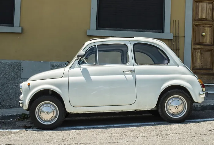 Framed Print : White small vintage Fiat Abarth. Sin light