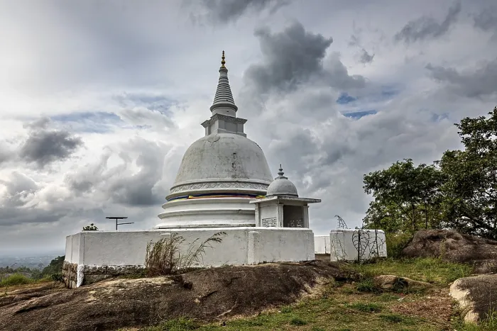 Framed Print : White stupa against dramatic sky surrounded by natural terrain Framed Print : White stupa against dramatic sky surrounded by natural terrain