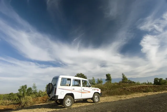 Framed Print : White sumo car under dramatic sky at Chikhaldara