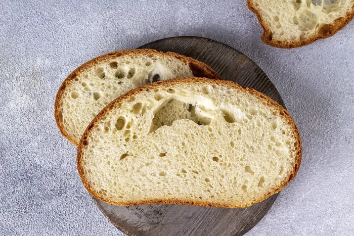Framed Print : White texture bread on a round wooden board Framed Print : White texture bread on a round wooden board