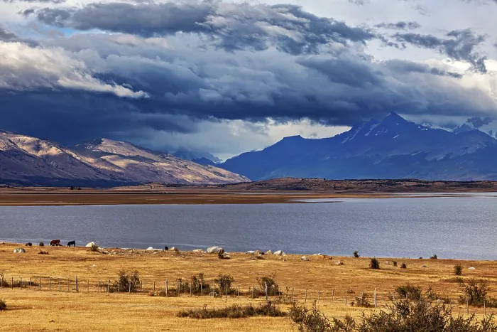Framed Print : A wide lake under dramatically threatening clouds Framed Print : A wide lake under dramatically threatening clouds