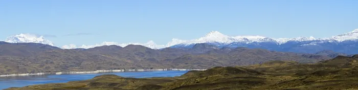 Framed Print : Wide landscape view of snowy mountains and lake under a clear sky