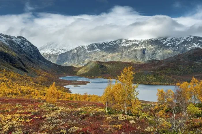 Framed Print : Wide valley with lake, snow-covered mountains and fells with colourful vegetation in autumn