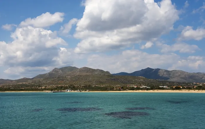 Framed Print : A wide view over the sea with mountains and clouds in the background Framed Print : A wide view over the sea with mountains and clouds in the background