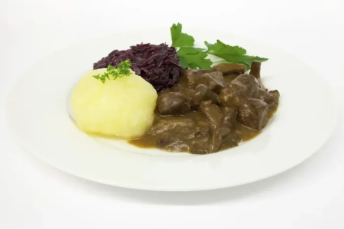 Framed Print : Wild boar goulash with potato dumpling and red cabbage