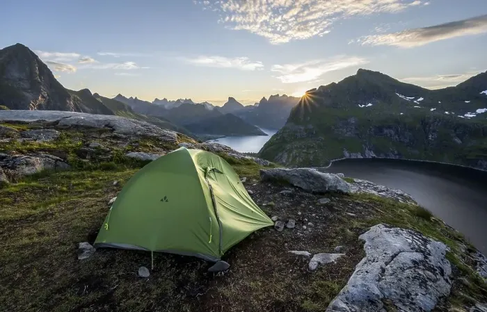 Framed Print : Wild camping with tent, sun shining over mountain landscape with fjord and lake Krokvatnet