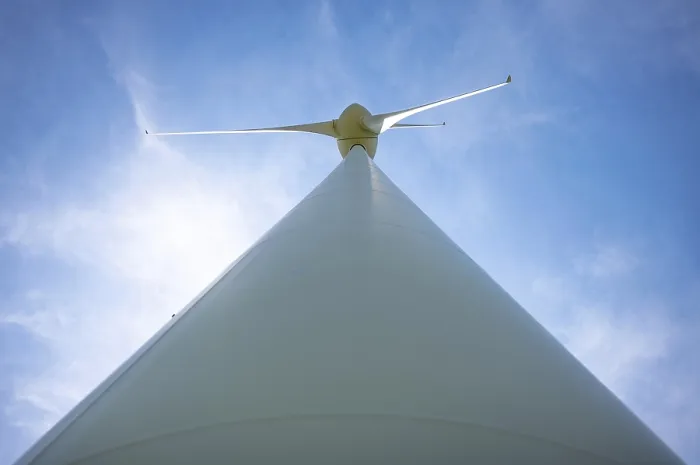 Framed Print : Wind Turbine with Sunlight and Against Blue Sky and Clouds in a Sunny Summer Day in Andermatt