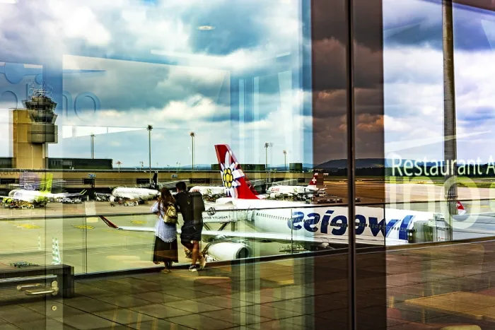 Framed Print : Window Reflection and a Couple Enjoy the View over the Airport