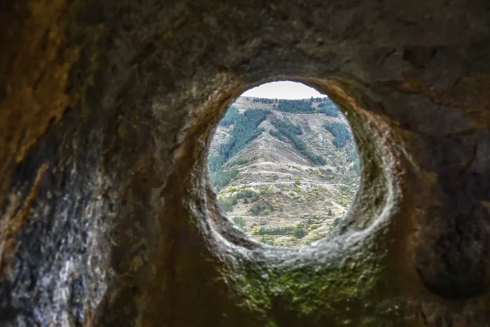 Framed Print : A window in a sandstone cave with a view of the opposite mountain