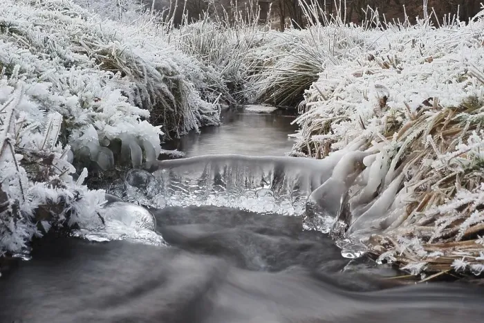 Framed Print : Winter landscape by a stream, hoarfrost and icicles