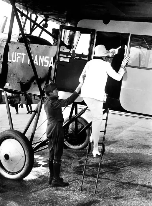 Framed Print : Woman boarding a Lufthansa passenger plane Framed Print : Woman boarding a Lufthansa passenger plane