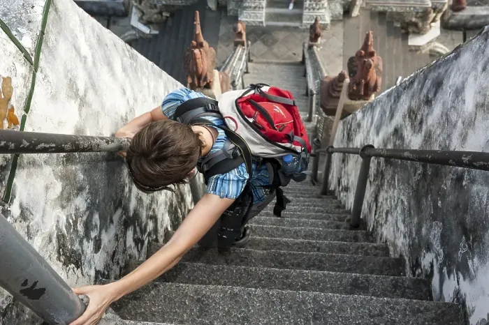 Framed Print : Woman climbing the stairs at Wat Arun Framed Print : Woman climbing the stairs at Wat Arun