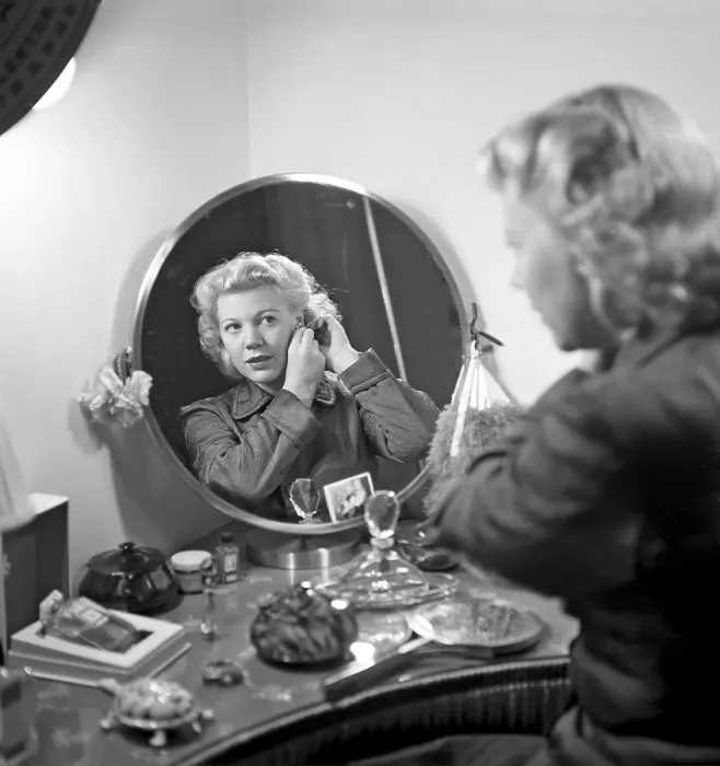 Framed Print : Woman combing her hair. Actress Irma Christenson