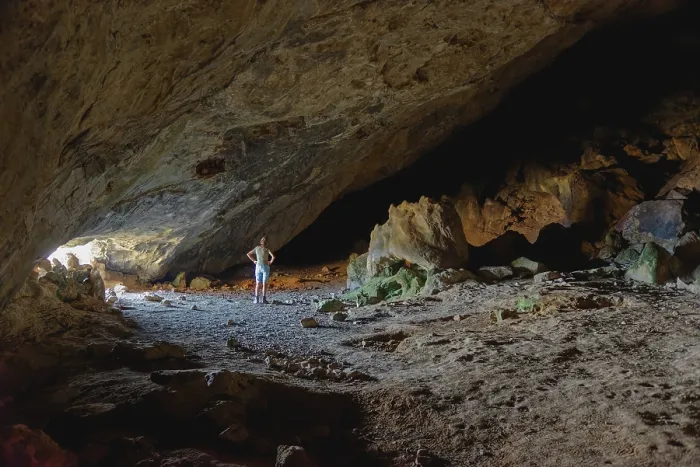Framed Print : Woman in the darkness of the vast Limniatis Cave Framed Print : Woman in the darkness of the vast Limniatis Cave